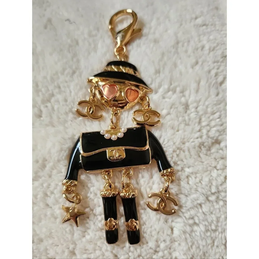 CHANEL Black and Gold Enamel Charm Doll with Pink Heart Sunglasses